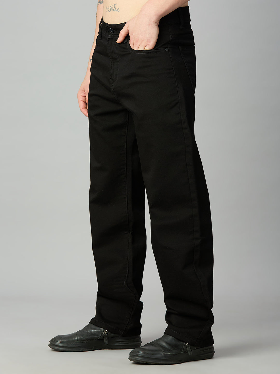 Premium black baggy stretch denim jeans for men with a relaxed oversized fit – left side view