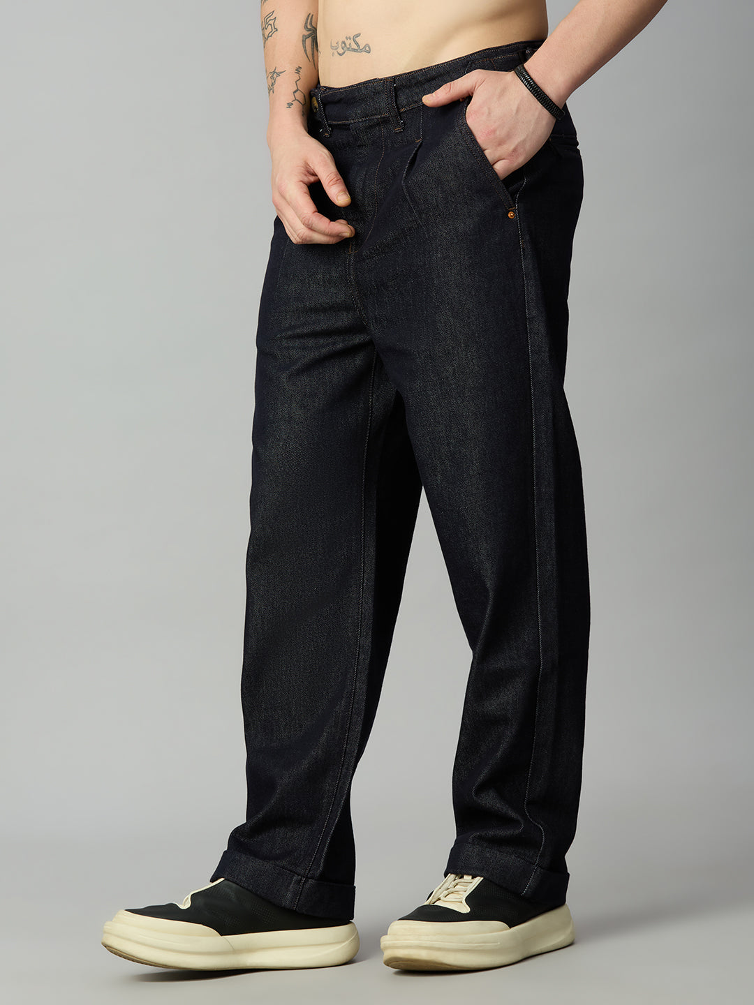 Men's relaxed baggy denim jeans featuring extended waistband and side waist adjusters – right side view