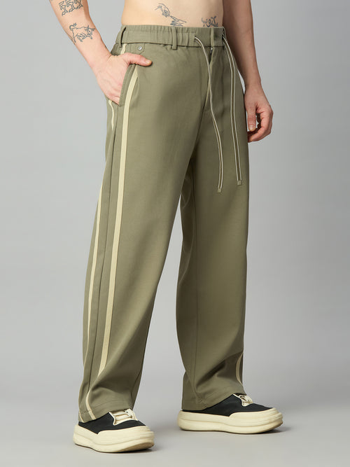 Men's baggy smart pants with athletic-inspired side stripe detailing – right side profile