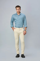 Model wearing LOFA beige slim fit formal trousers – modern stretch comfort and timeless design for men’s formal wear.