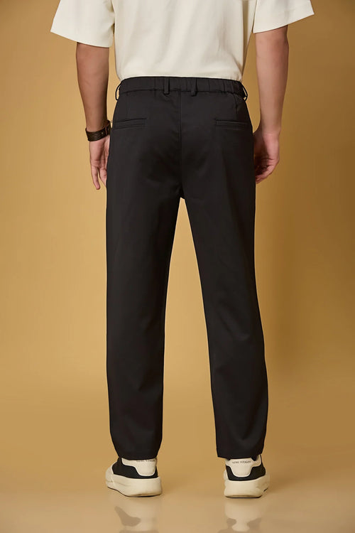Men’s black casual trousers back view – smooth polyester comfort fabric.