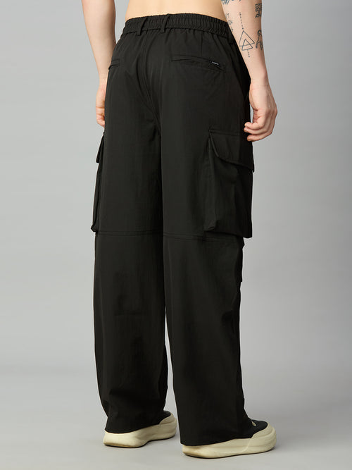 Black wide-leg cargo pants with an elastic waistband, shown from the back on a model against a neutral gray background.