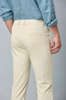 Close-up of cotton–polyester–spandex fabric showing fine stitching and smooth stretch texture of LOFA beige formal trousers.