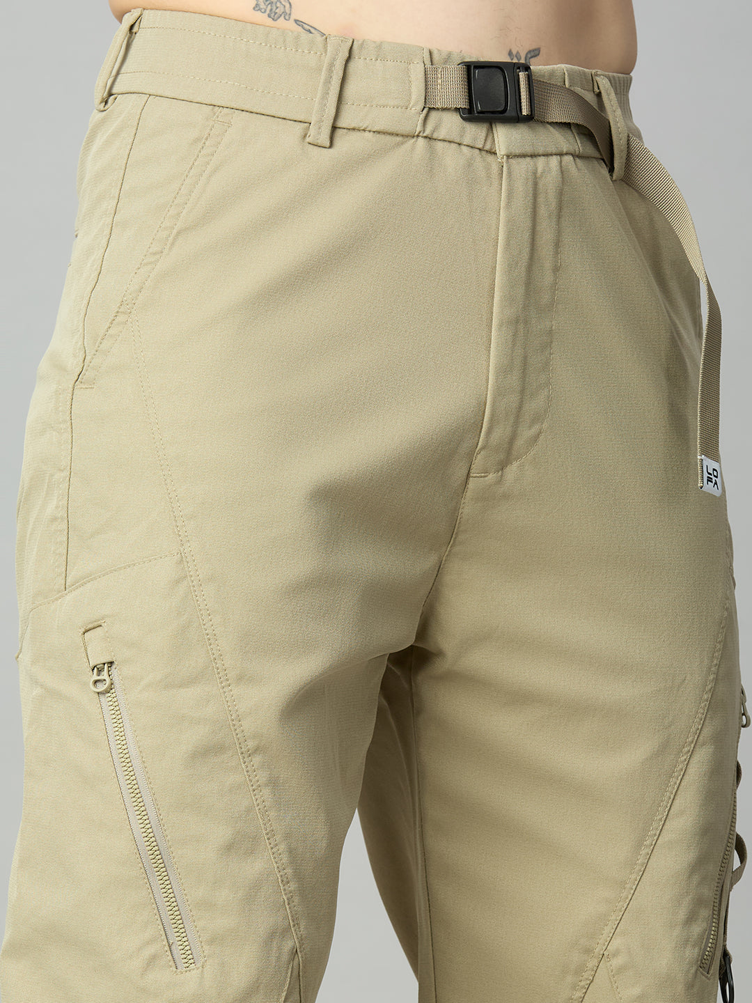 Close-up of premium Tencel fabric, attached belt, and utility detailing on men's cargo pants