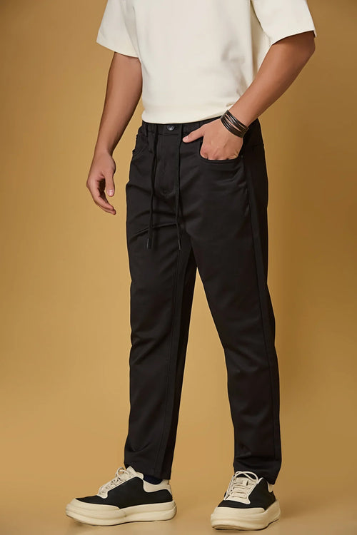 black stretchable trousers side view showing casual comfort fit.