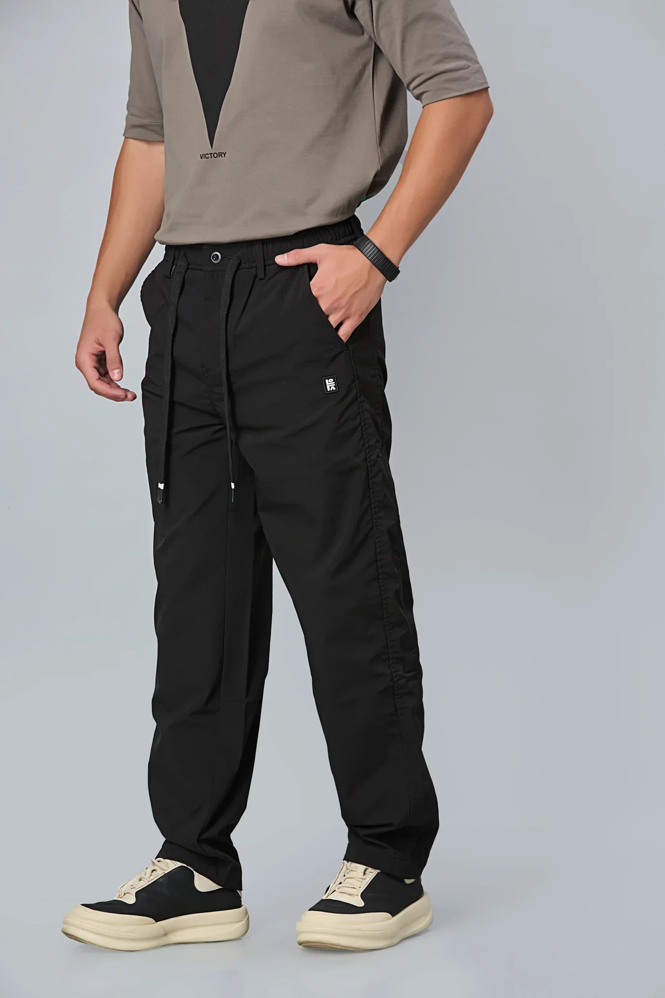 Side View of LOFA Black Comfort Fit Trousers with Waist String