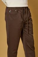 Close-up of Coffee Brown polyester fabric texture showing smooth and stretchable finish.