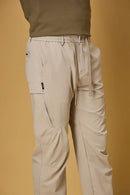 Close-up of khaki trousers waist strings, side pockets, and smooth fabric texture.