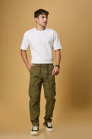 Men wearing LOFA Mehndi Green cargo pants in a casual outdoor setting.