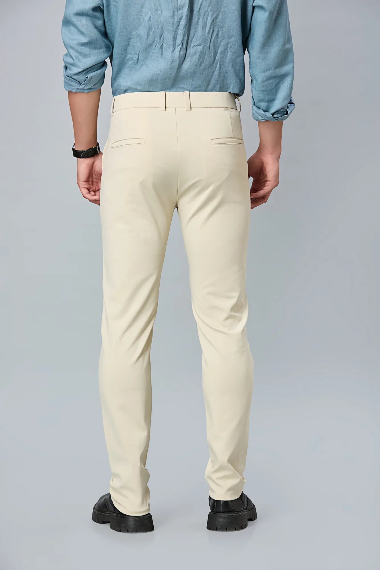 Back view of LOFA beige slim fit formal trousers – clean seams, tailored structure, and premium cotton stretch fabric.