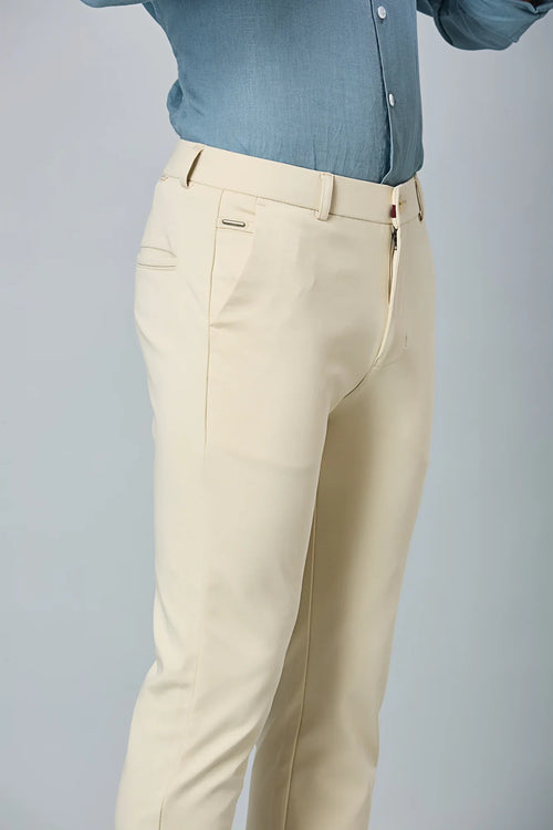Close-up of cotton–polyester–spandex fabric showing fine stitching and smooth stretch texture of LOFA beige formal trousers.