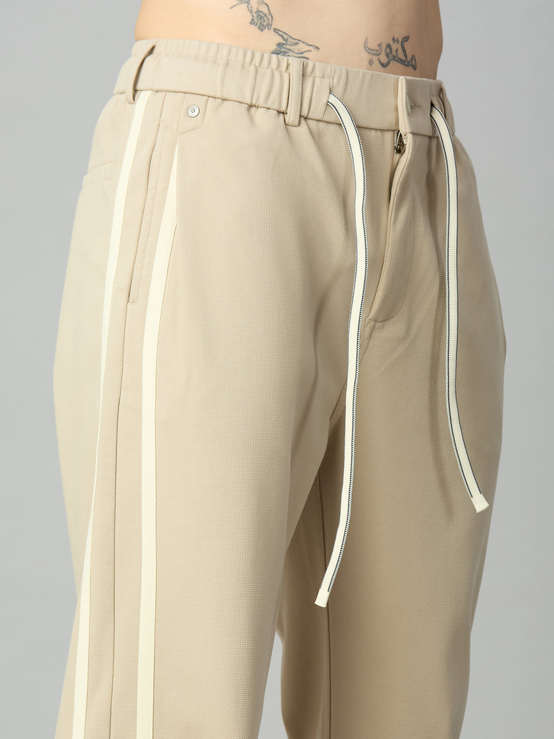 Close-up of contrast side stripe detailing on premium cotton-Tencel smart pants