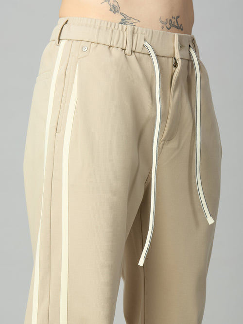 Close-up of contrast side stripe detailing on premium cotton-Tencel smart pants