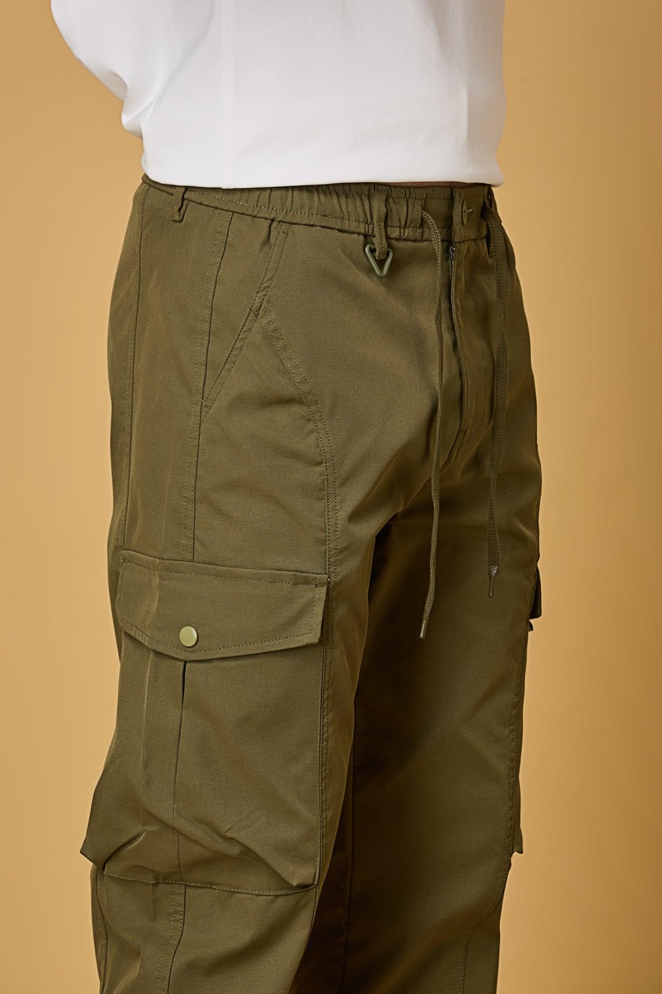 Close-up of Mehndi Green cargo pants, waist string and pocket detailing.