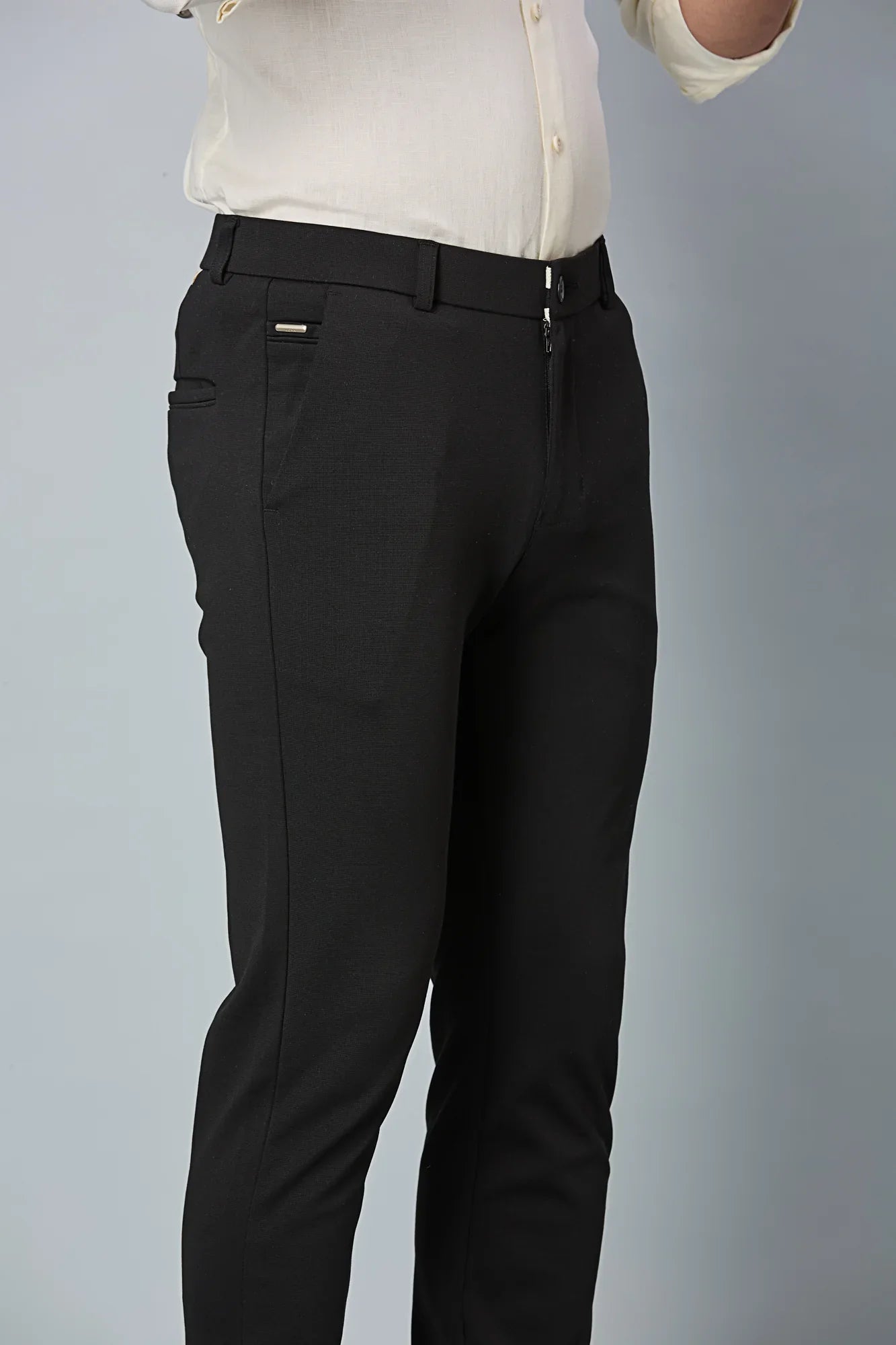 Close-up of cotton–polyester–spandex fabric showing fine stitching and smooth stretch texture of LOFA Black formal trousers.