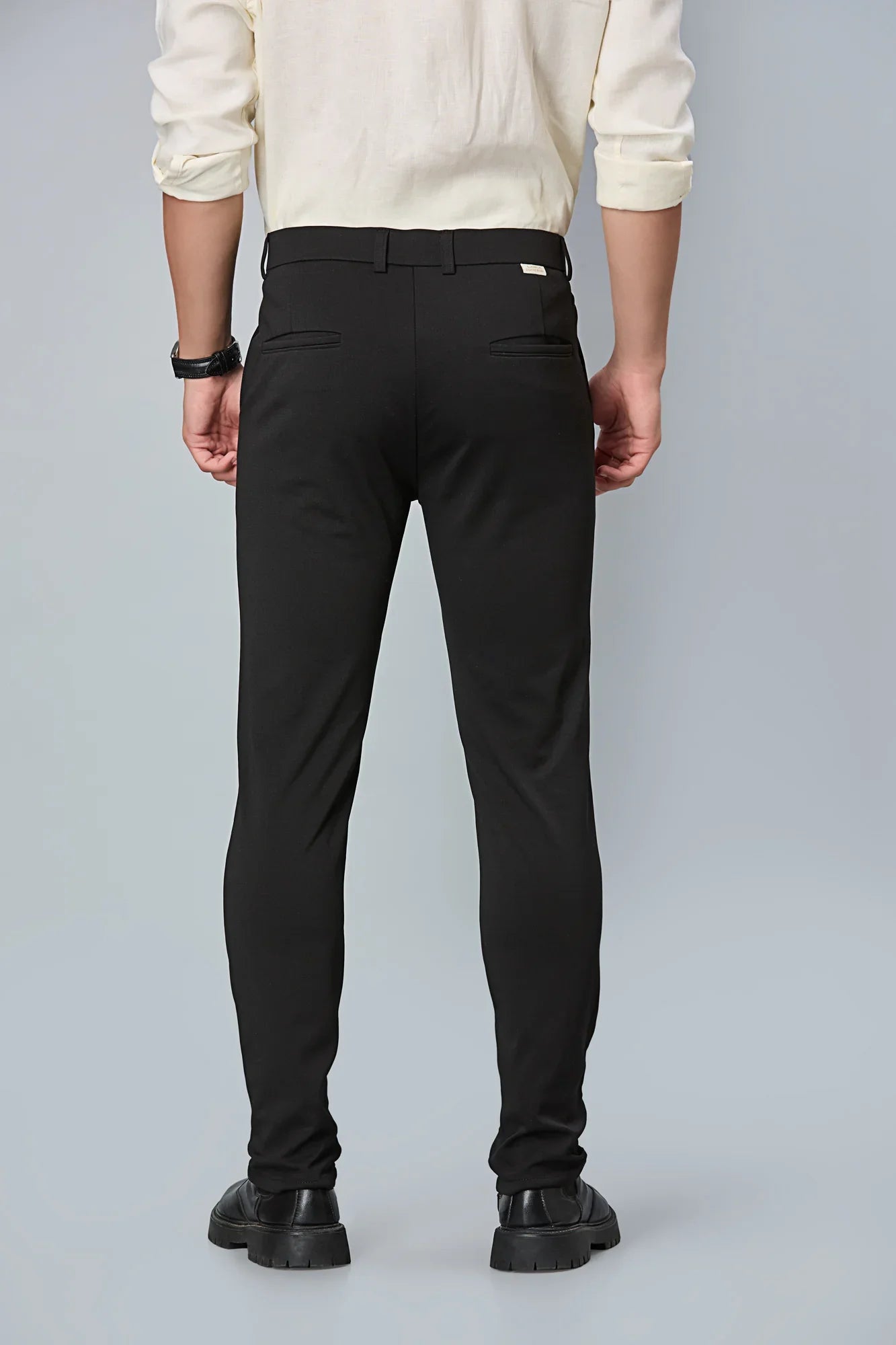 Back view of LOFA Black slim fit formal trousers – clean seams, tailored structure, and premium cotton stretch fabric.