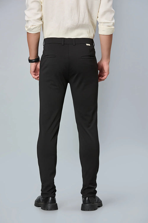 Back view of LOFA Black slim fit formal trousers – clean seams, tailored structure, and premium cotton stretch fabric.