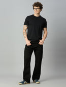 Model wearing The Lofa men's black straight fit stretch denim jeans styled for a clean everyday casual look