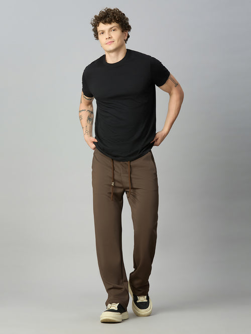 Model wearing Lofa™ relaxed fit Tencel stretch pants styled for everyday comfort and modern casual wear