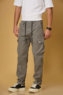grey pants side view showing double cargo pockets and relaxed fit.