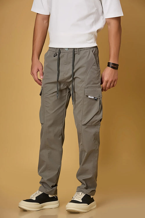 grey pants side view showing double cargo pockets and relaxed fit.