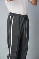 Close-up of polyester spandex blend fabric of LOFA men’s active pants – soft, smooth, and stretchable texture.