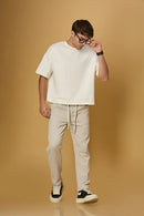 LOFA beige comfort fit trousers styled for men – casual and stretchable look.