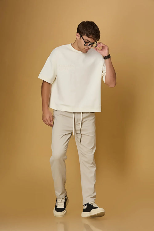 LOFA beige comfort fit trousers styled for men – casual and stretchable look.