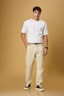 Full outfit look with LOFA beige straight fit trousers and built-in belt – styled for a refined office or formal look.