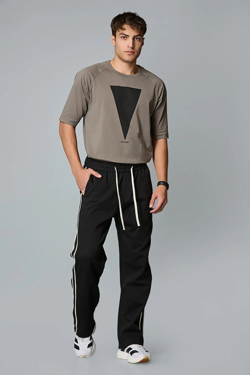 Side View of LOFA Men’s Black Baggy Fit Active Pants with Waist Strings