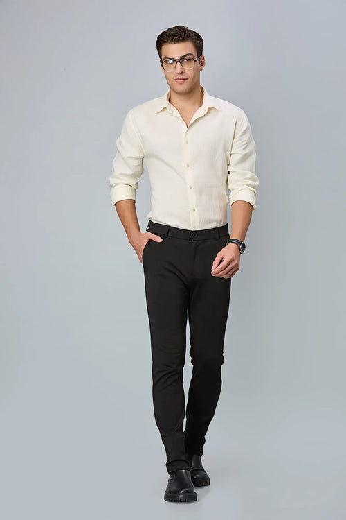 Model wearing LOFA Black slim fit formal trousers – modern stretch comfort and timeless design for men’s formal wear.