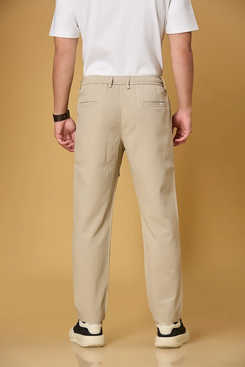 Men’s light khaki trousers back view – soft Tencel-cotton blend fabric.