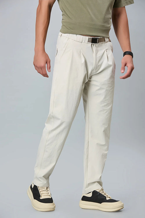 Beige stretchable trousers side view showing comfort fit and pleated front.