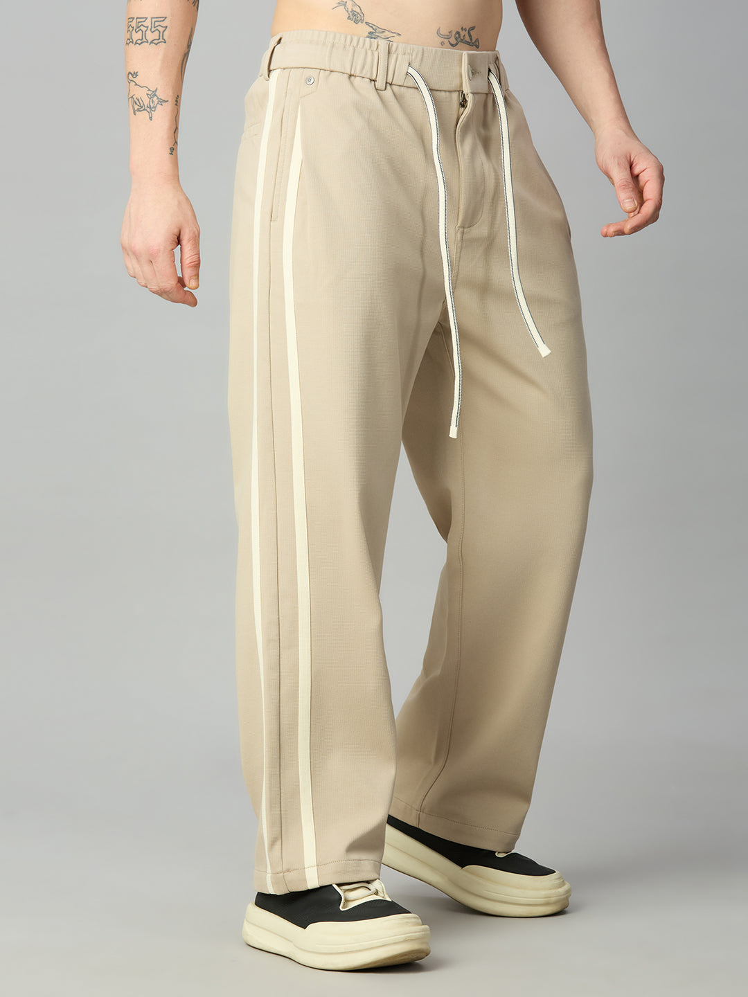 Men's relaxed fit cotton-Tencel smart pants with contrast side stripes – left side profile