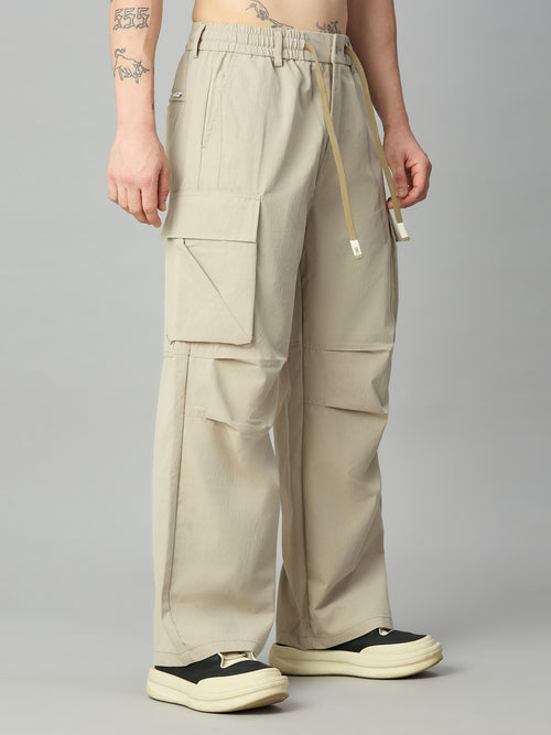 Men's relaxed fit cargo pants left side view showing utility pockets
