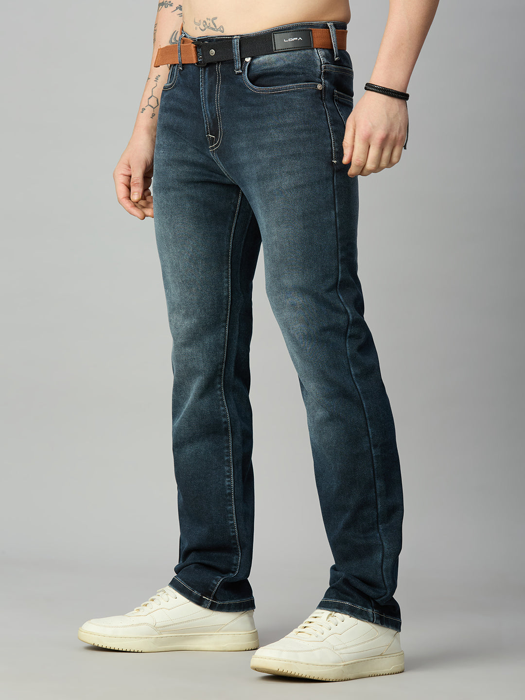 Premium straight fit denim jeans for men with integrated webbing belt and deep blue wash – left side view