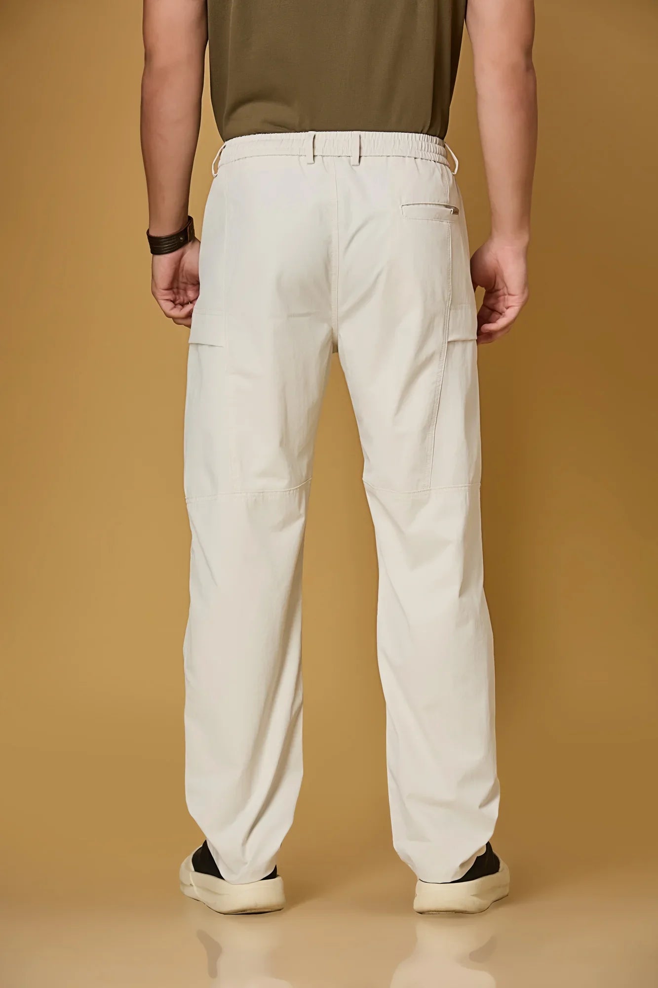 Men’s beige casual pants back view – polyester stretch fabric comfort fit.