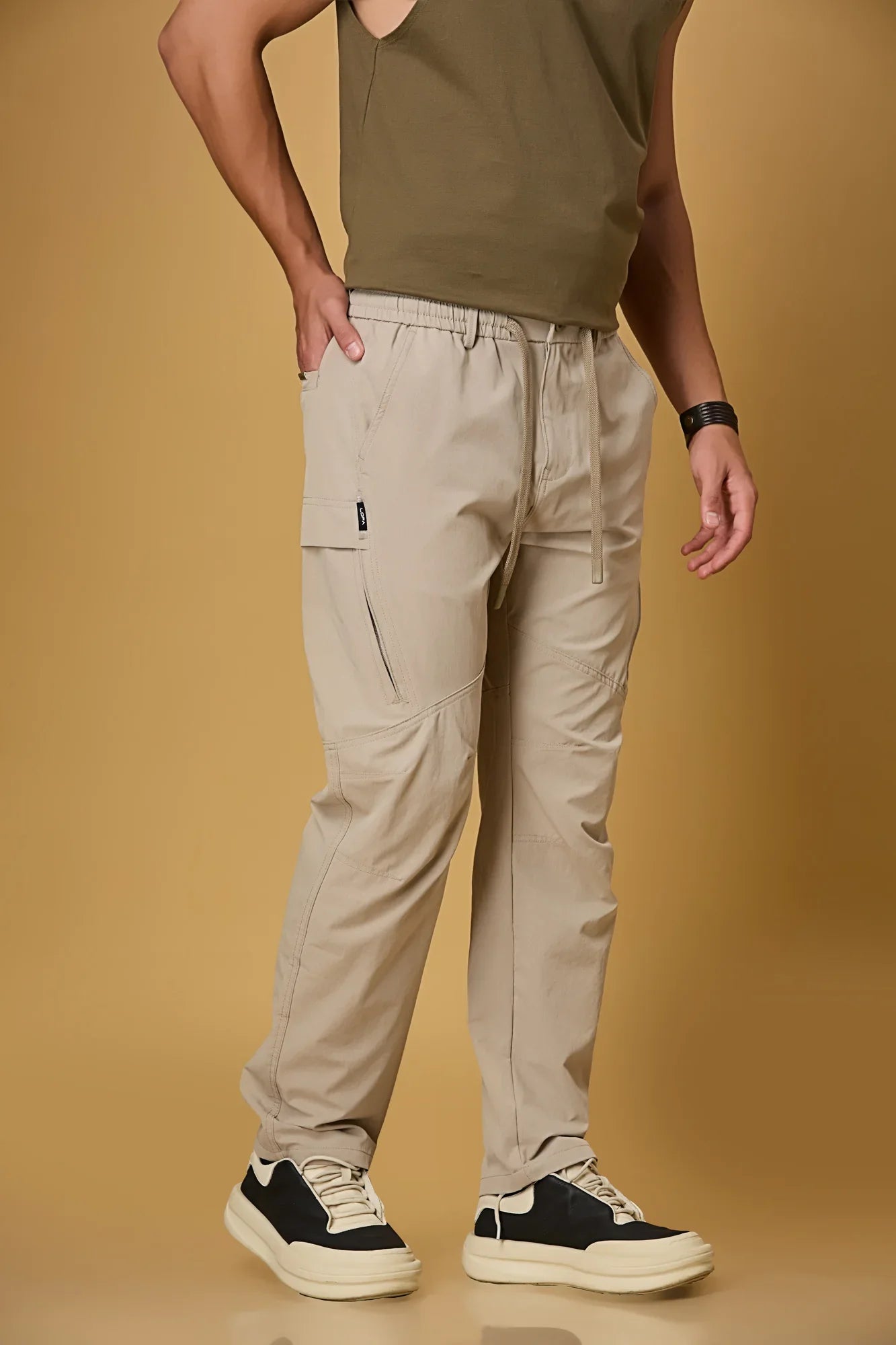 Khaki stretchable trousers side view showing two side pockets and relaxed fit.