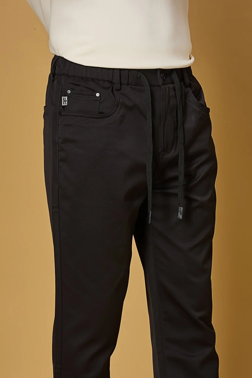 Close-up of black polyester fabric texture showing smooth and stretchable finish.