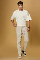 Men wearing LOFA beige polyester trousers – relaxed and stylish everyday outfit.