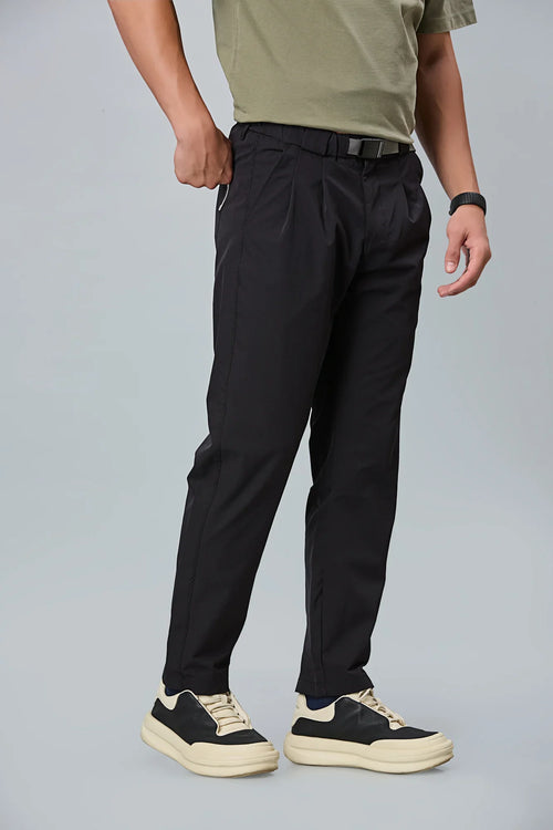 black stretchable trousers side view showing comfort fit and pleated front.